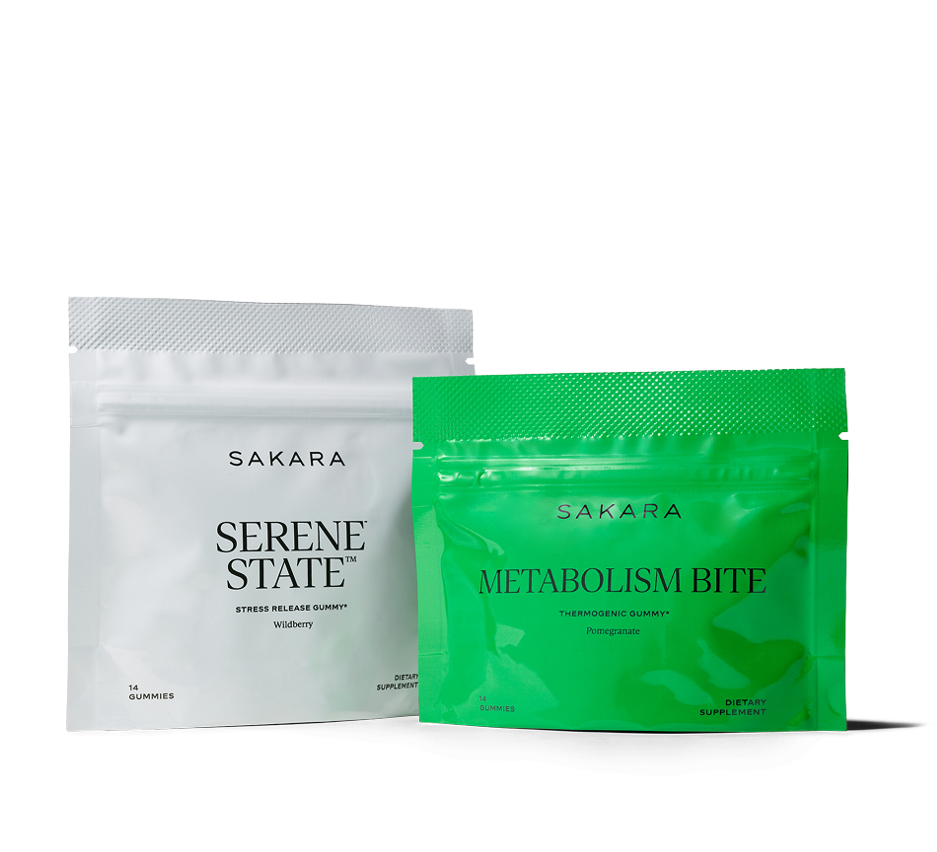Two Sakara gummy pouches: one white "Serene State Stress Release Gummy" (Wildberry) and one green "Metabolism Bite Thermogenic Gummy" (Pomegranate).