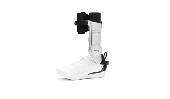 A white sneaker with a silver and black robotic leg brace attached, branded "dephy."