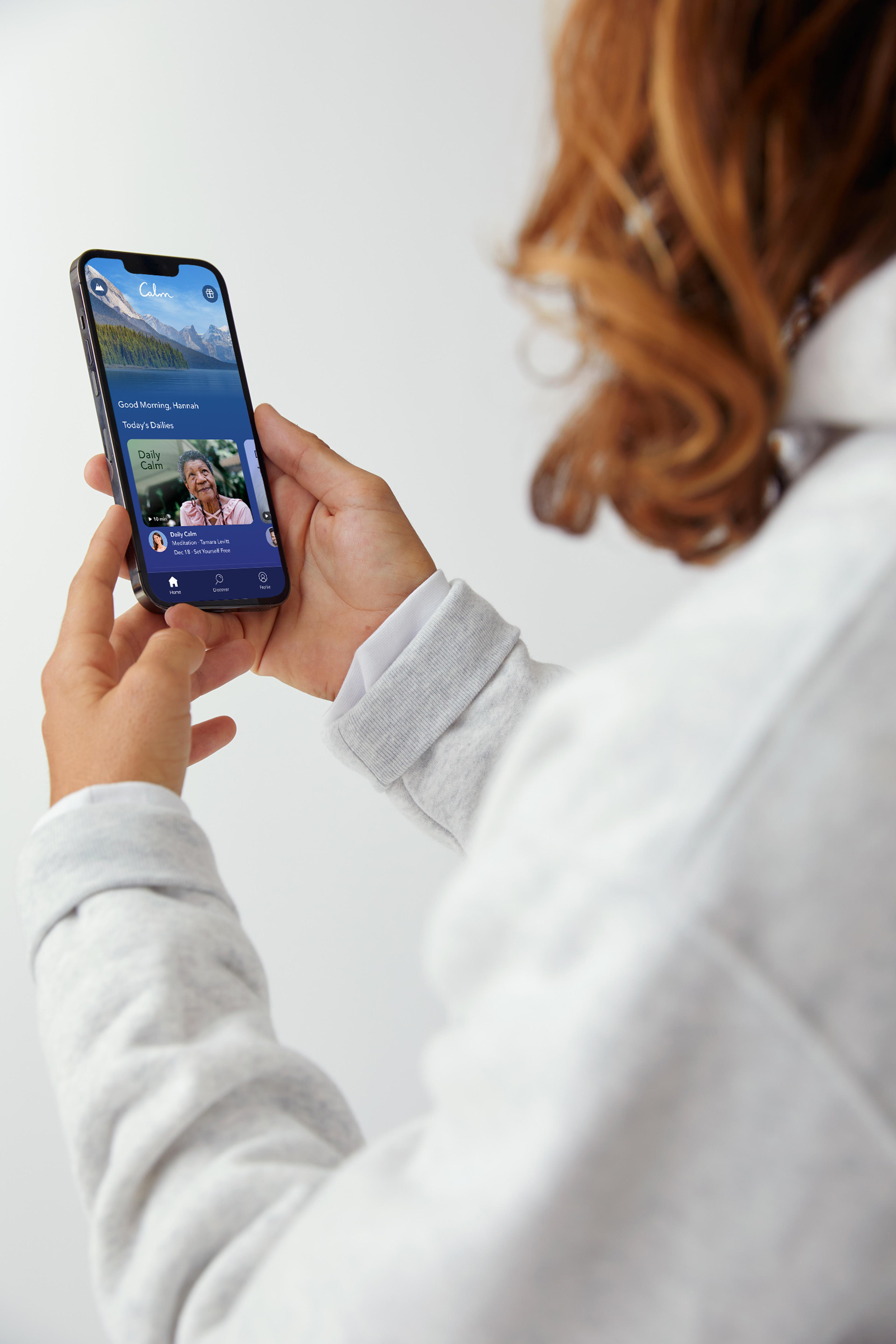 Person holding a phone with the Calm app open