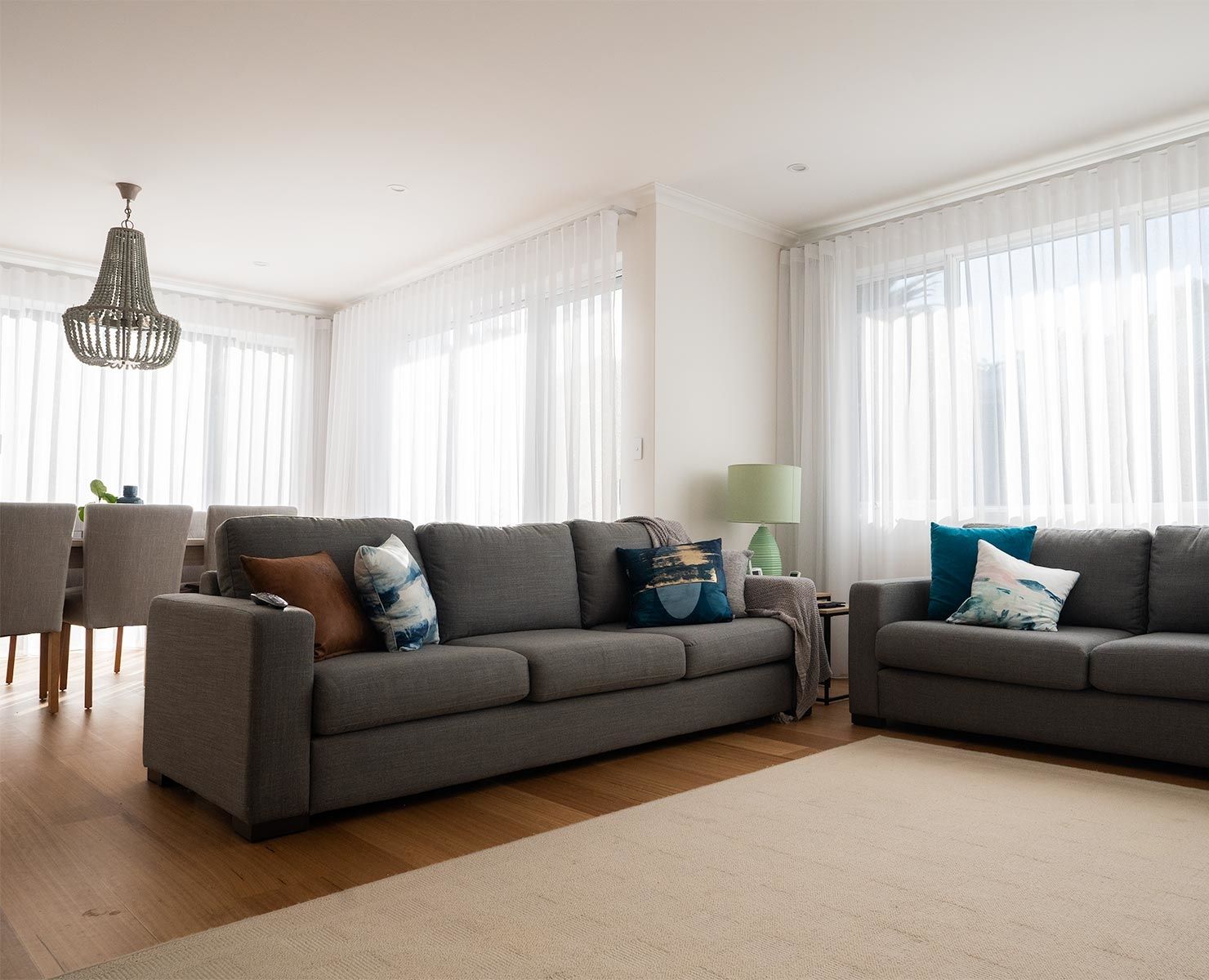 Floor-to-ceiling curtains making a room feel taller