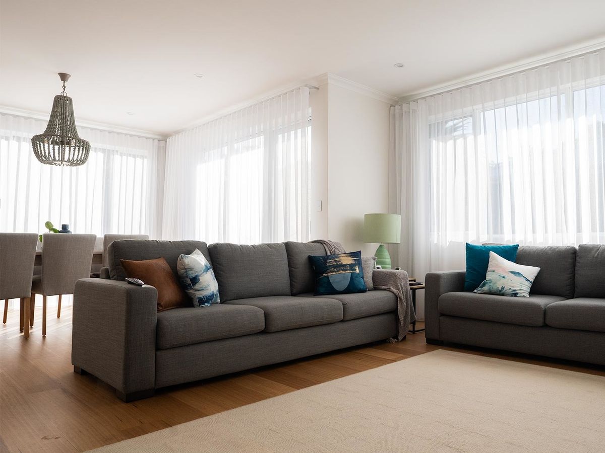 Floor-to-ceiling curtains making a room feel taller