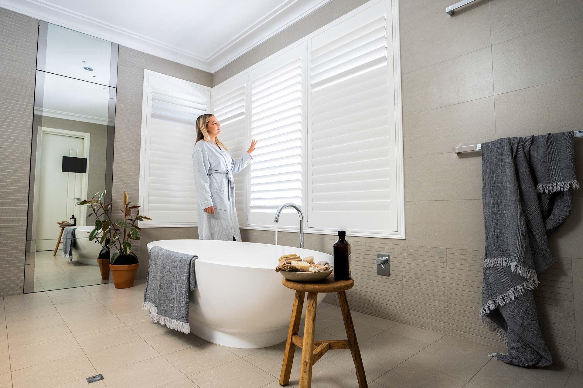 Waterproof Norman Woodlore Plus shutters in a light-filled bathroom