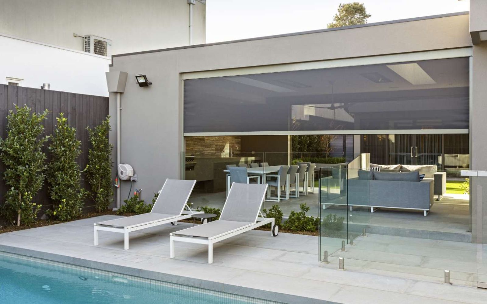 Poolside alfresco with an outdoor zip screen