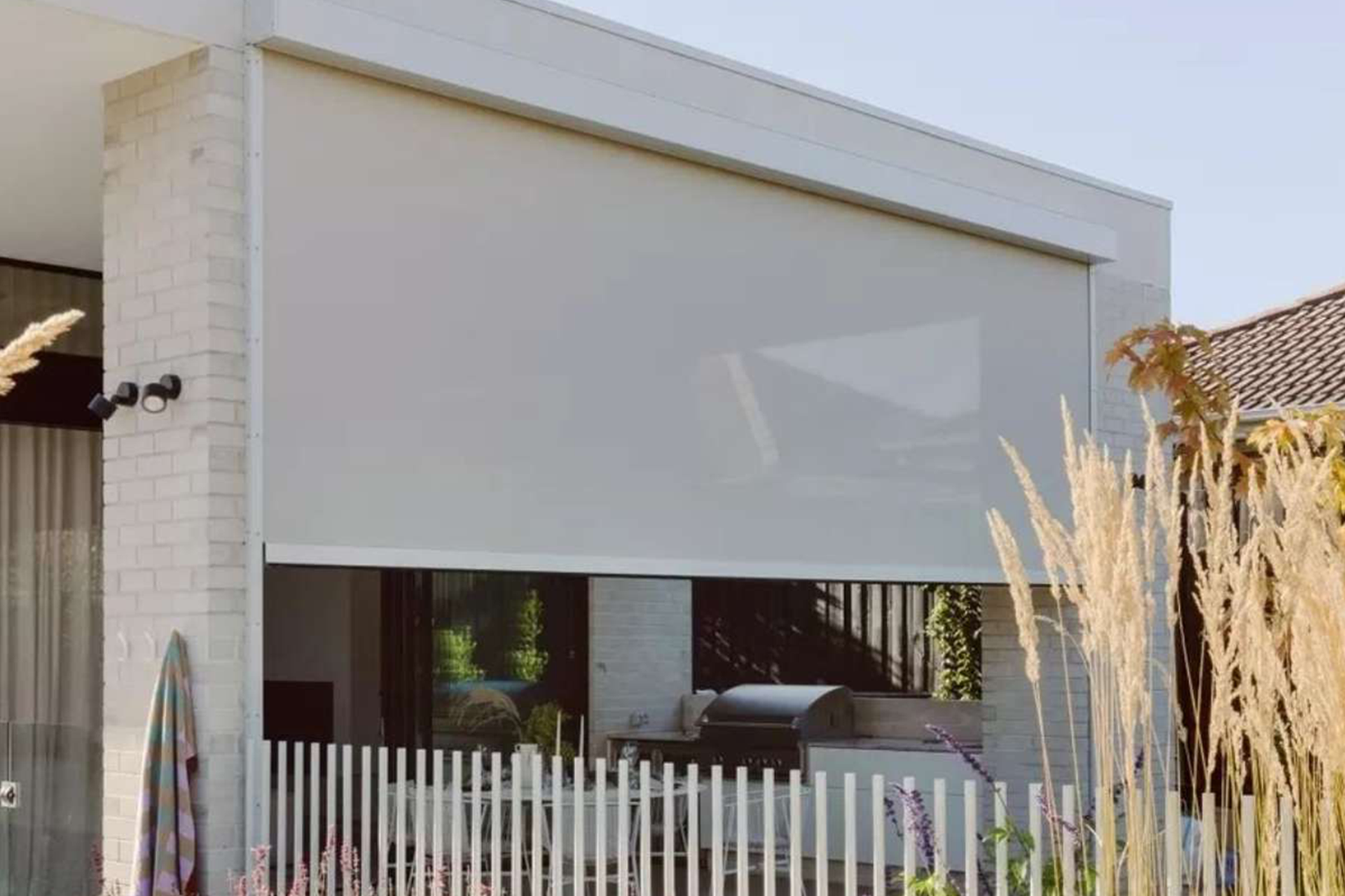 Outdoor zip-track blind lowered on a Perth alfresco