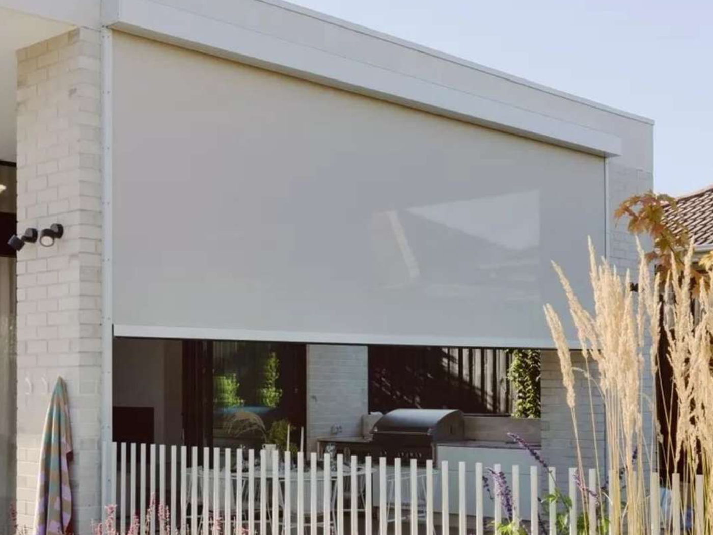 Outdoor zip-track blind lowered on a Perth alfresco