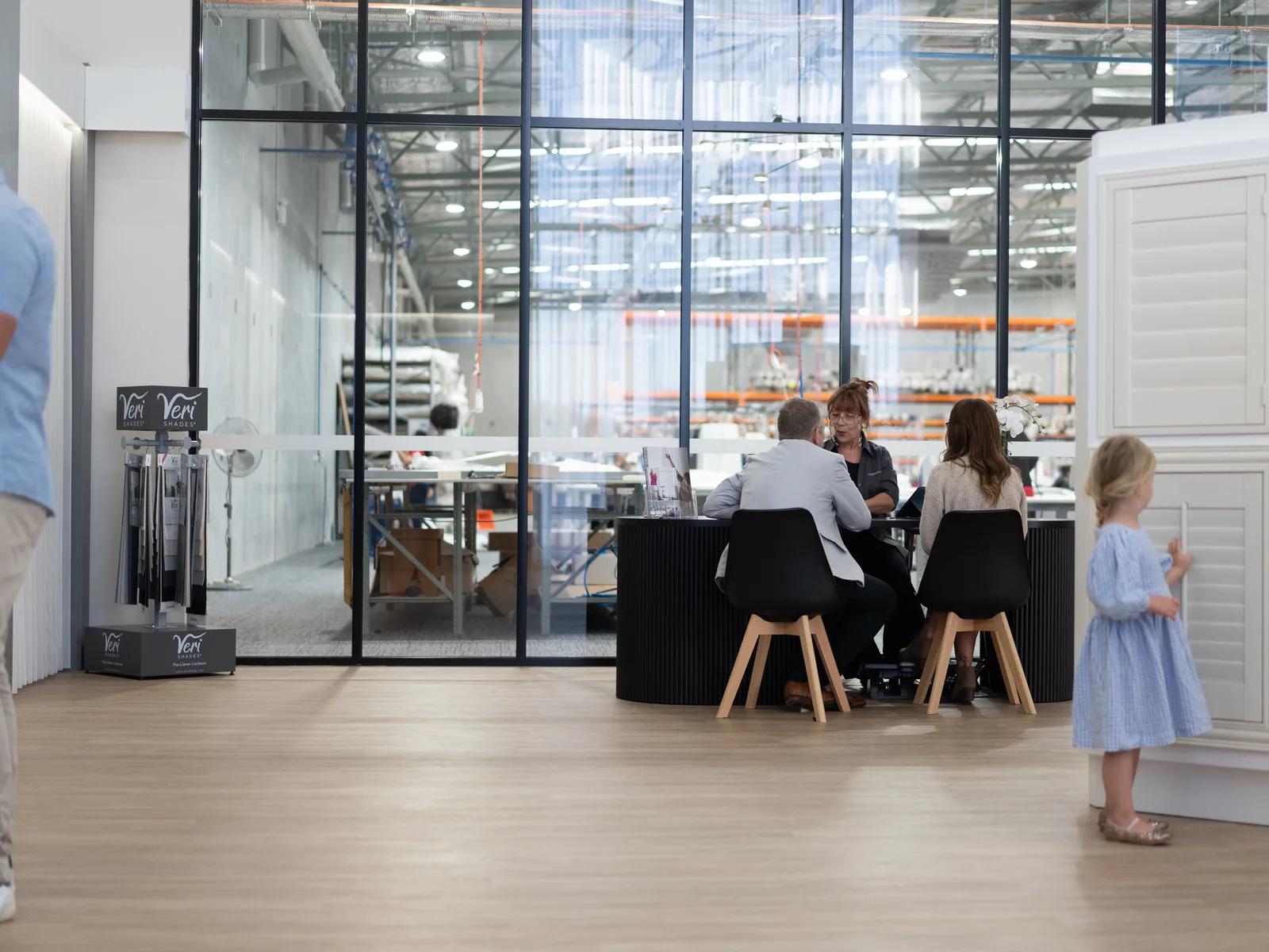 Consultation tables beside the factory windows