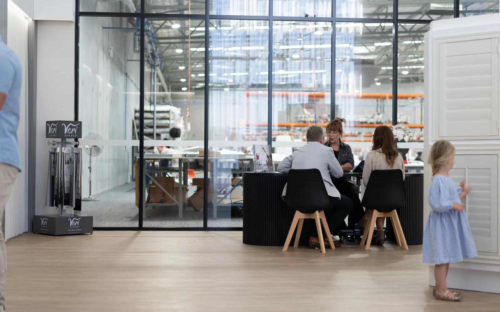 Consultation tables beside the factory windows