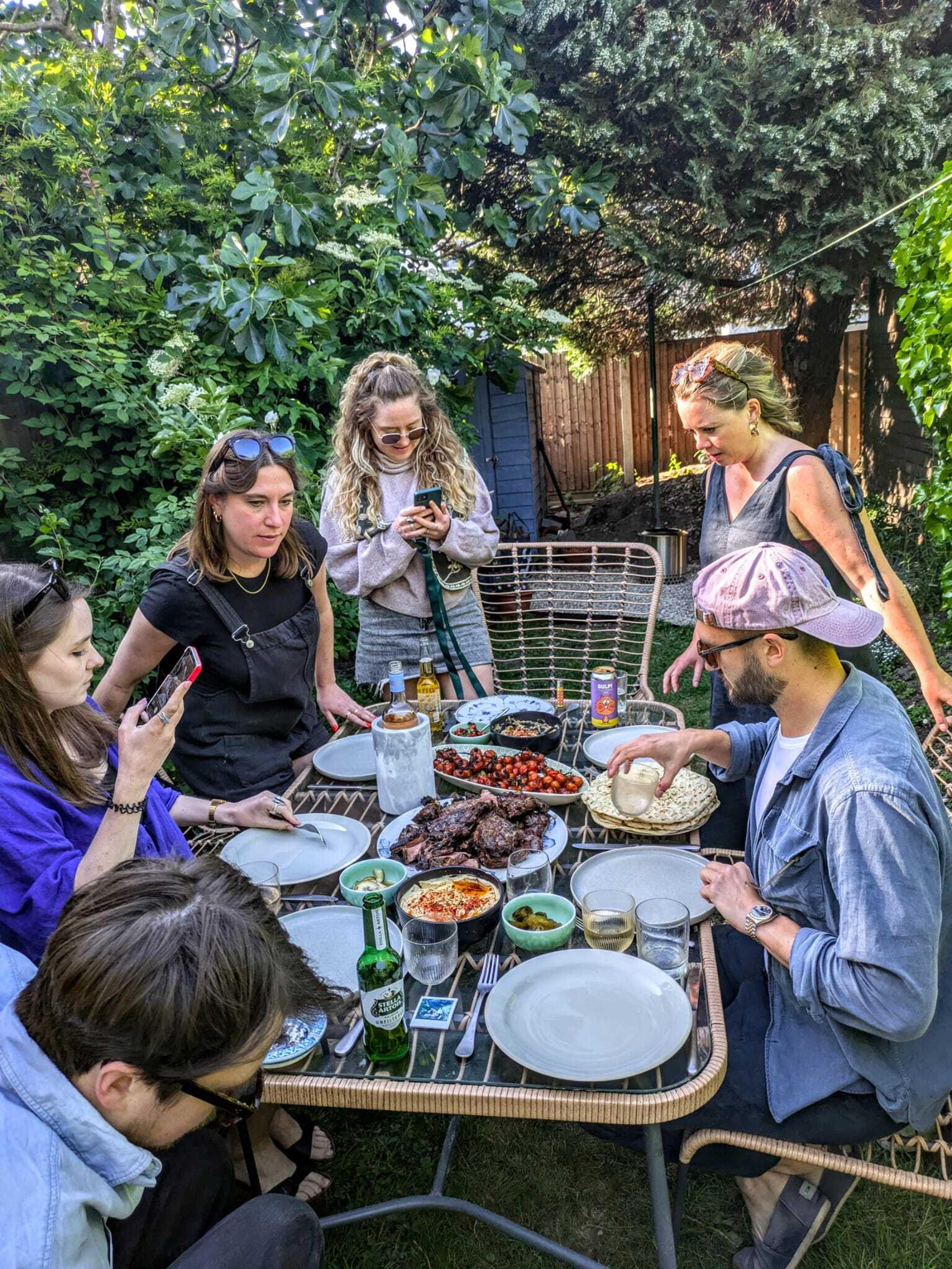 A group of people enjoying a barbecue