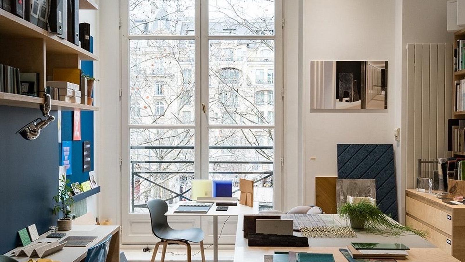 An independent professional at work in a design studio, representing the skill and value behind well-priced services
