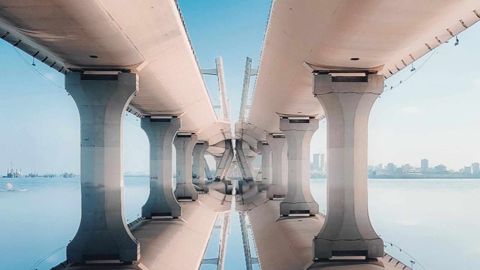 A symmetrical modern bridge reflected perfectly in still water, symbolizing matching and balance