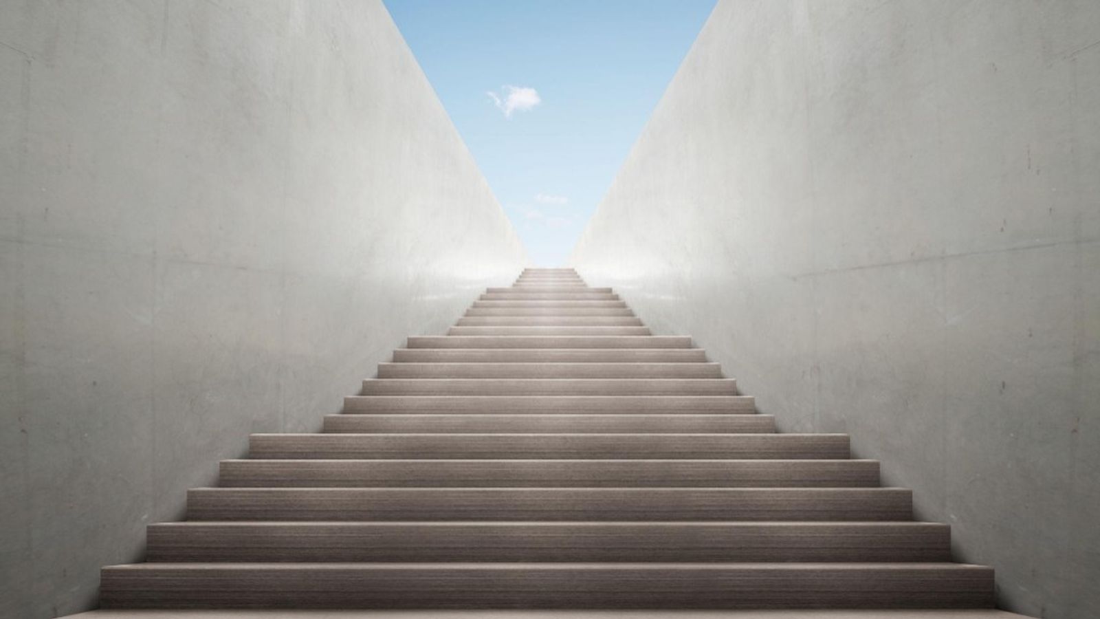 A wide staircase rising between light gray walls toward a bright sky, evoking steady forward progress