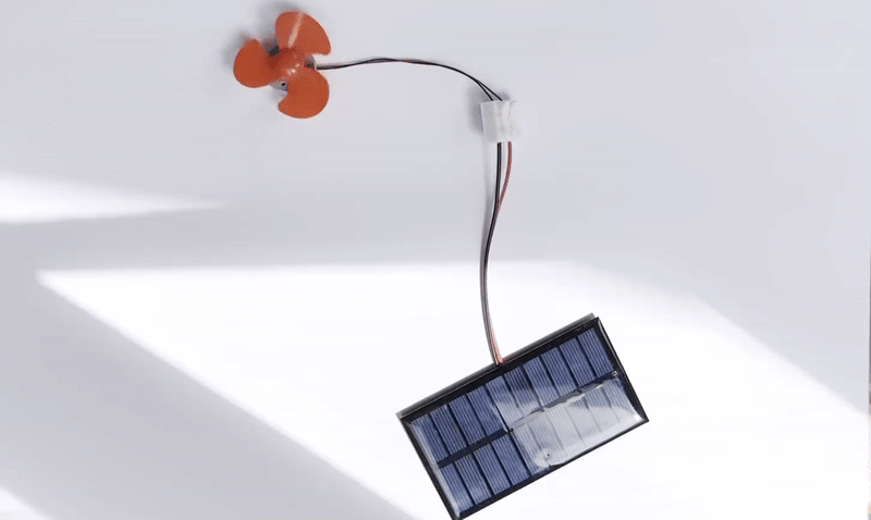 Students testing solar photovoltaic cells under different light conditions