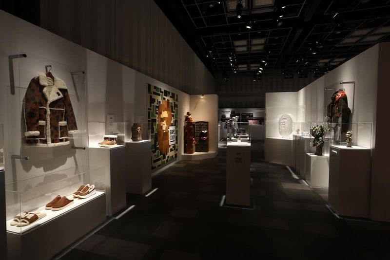 Adam Lister X Budmen 8Bit3D BAPE Head (far left) on display at the BAPE® XXV Exhibit