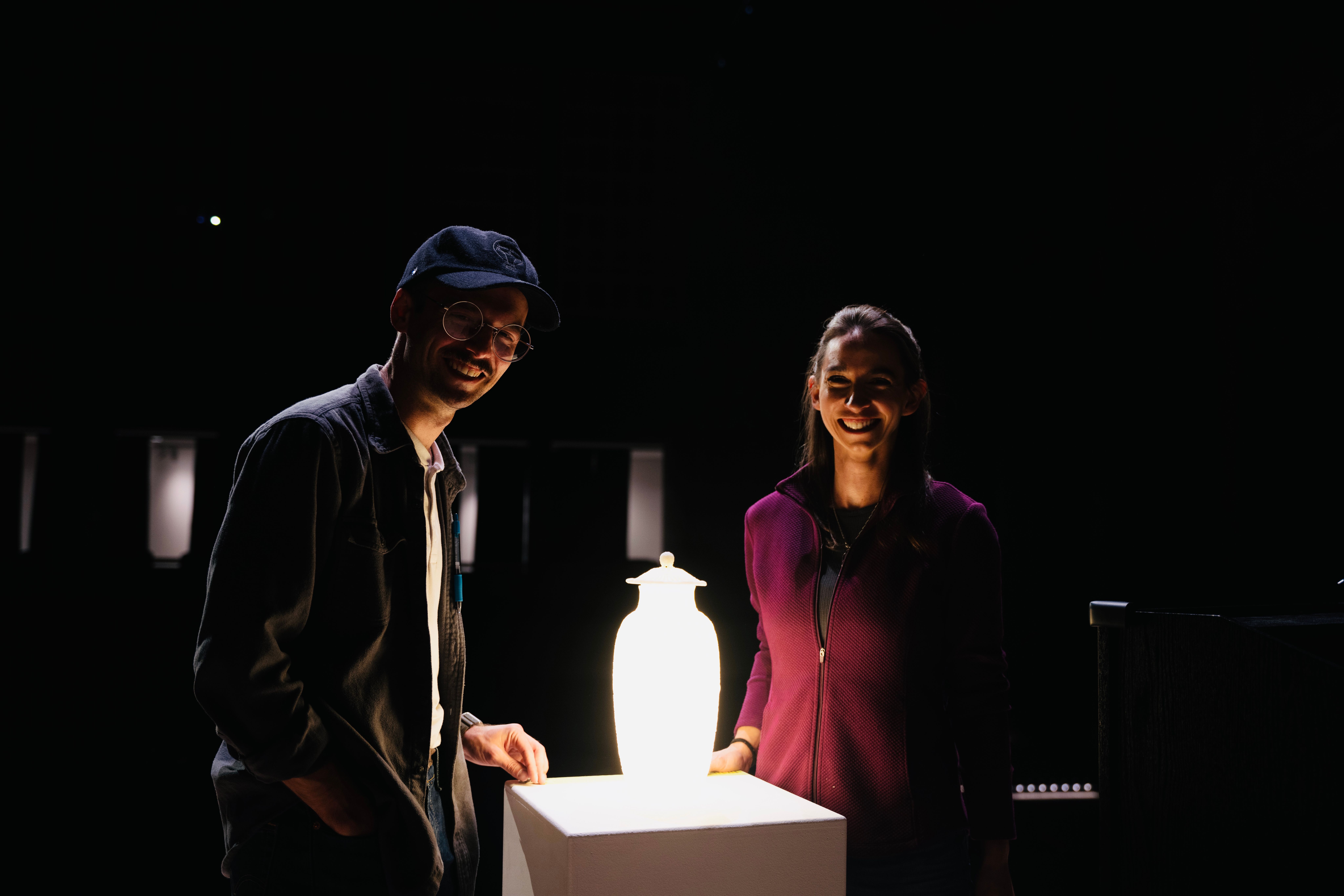 Isaac and Stephanie Budmen standing next to the Please Touch Scarav Vase