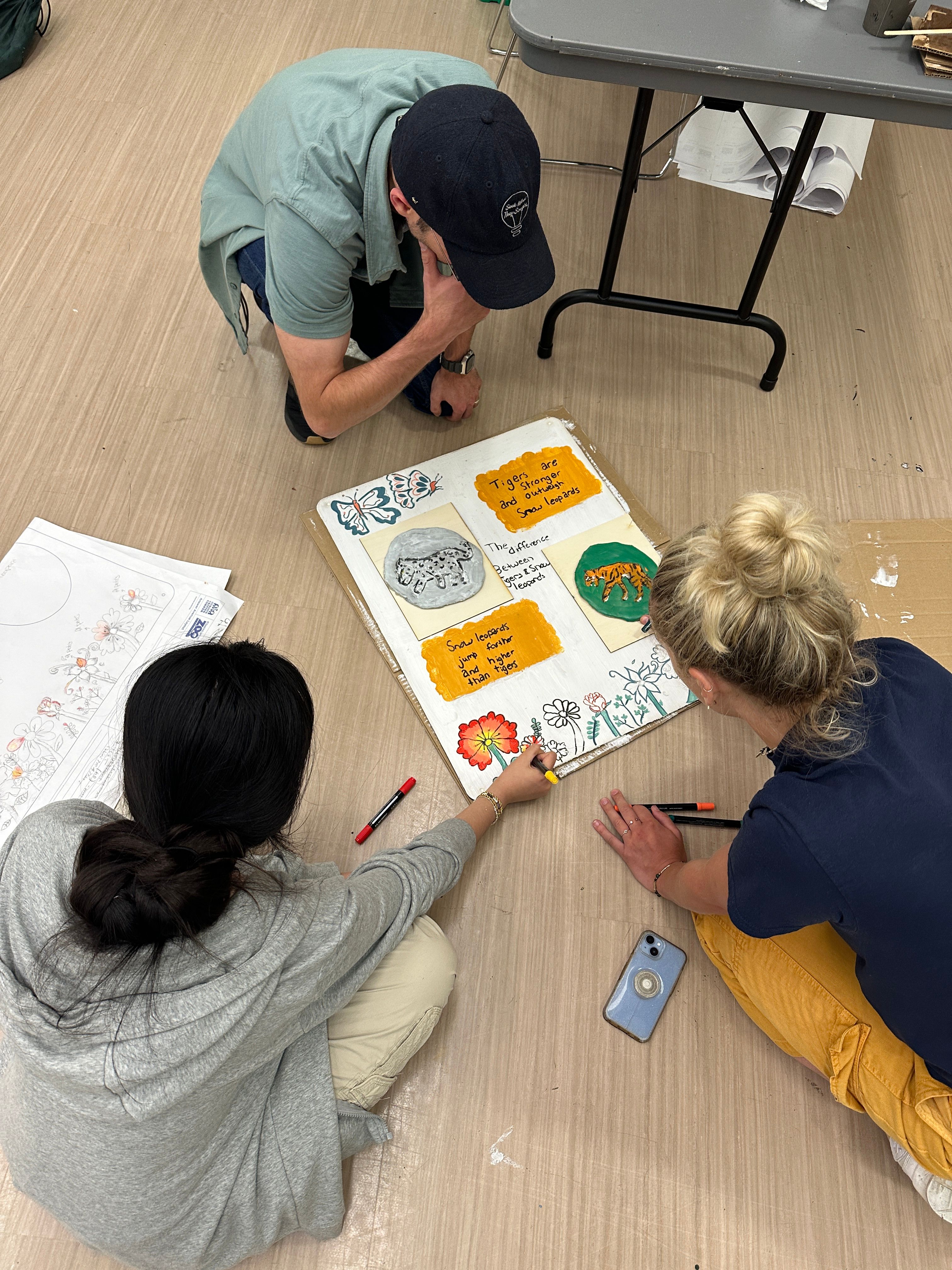 Students transferring information from their blueprint onto wood.