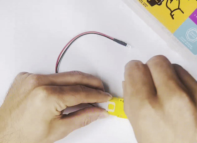 Student testing dynamo generator understanding kinetic energy conversion