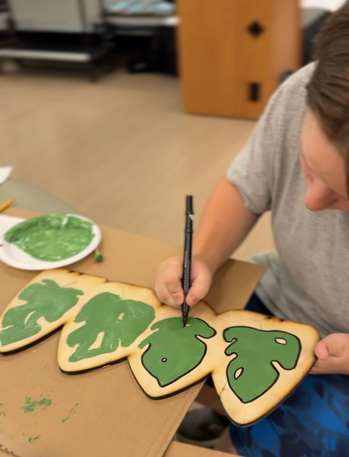 Students assembling exhibits on their Curious Critter Corner.