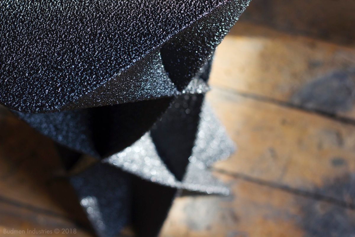 Scoria Stool with complex faceted and bent forms