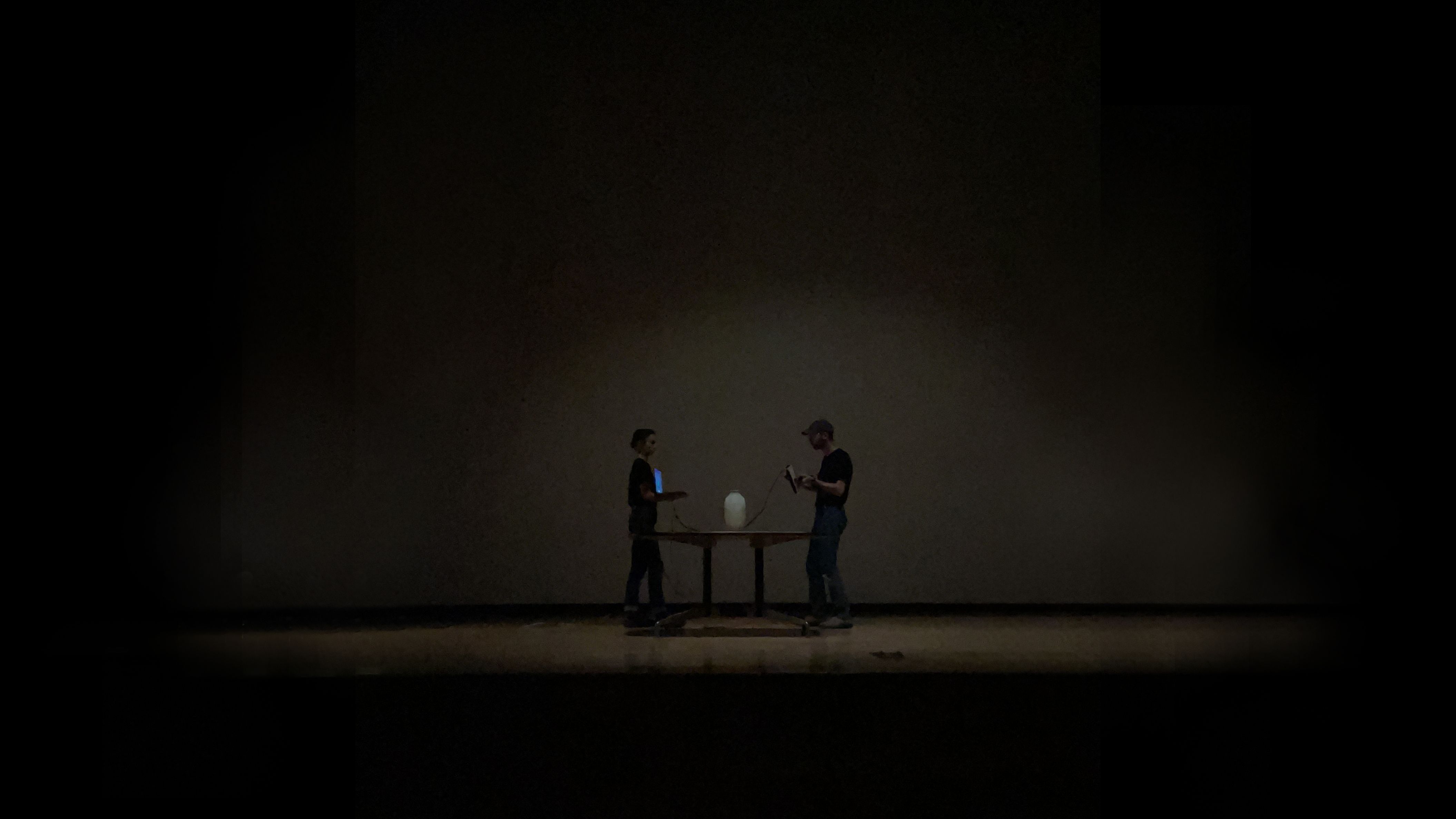 Everson Museum auditorium in complete darkness with vase on scanning platform