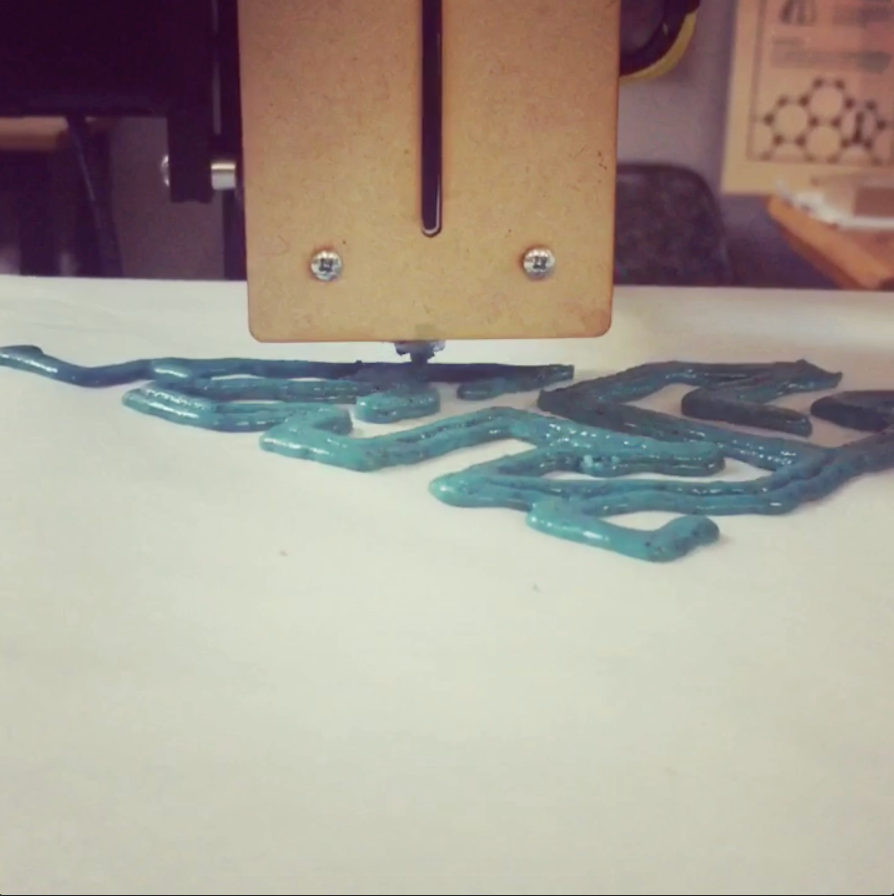 3D printed geometric macarons in bright blue, red, and white colors