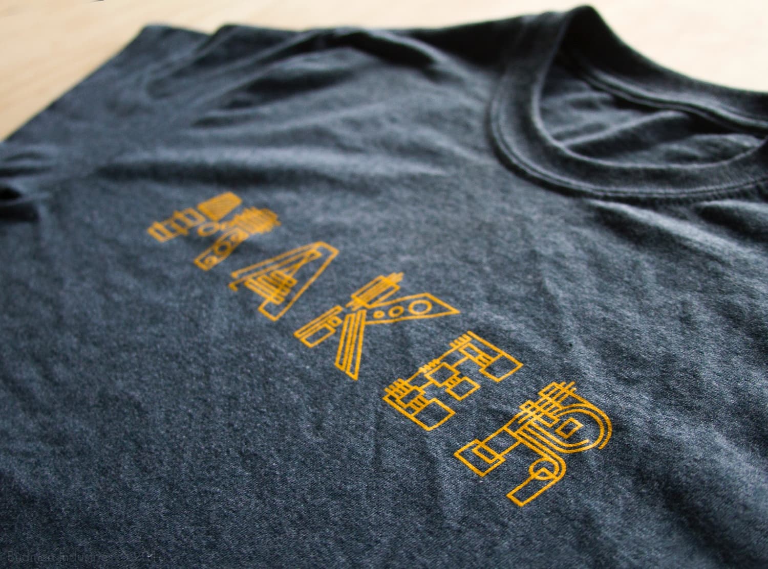 Close-up detail of Contraption letterforms showing gear and circuit construction