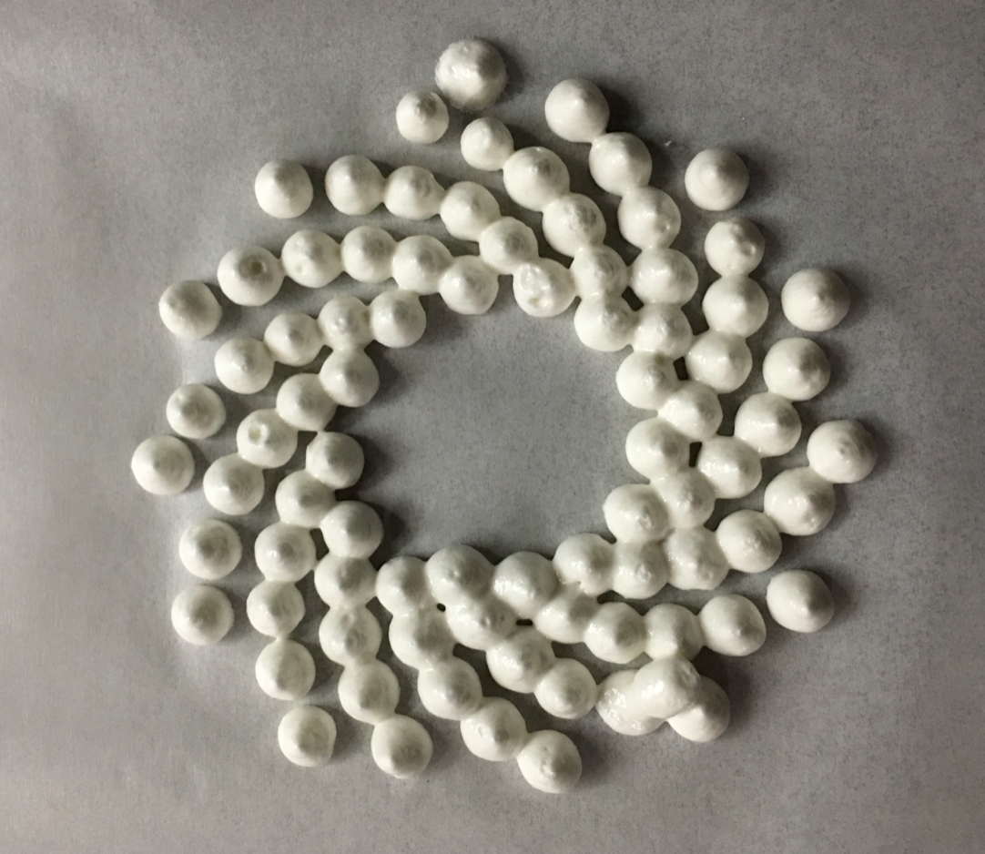 3D printed Fibonacci spiral pattern made of dolloped Kiss shapes