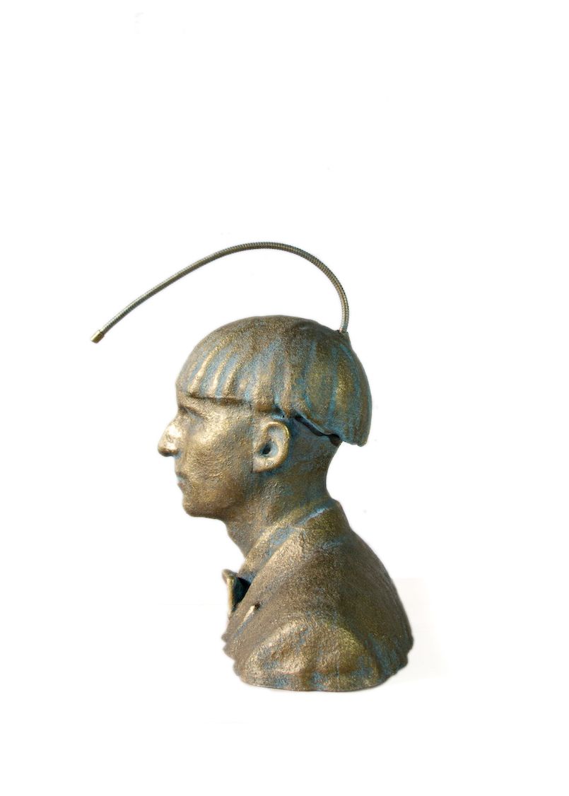 Finished sculpture with bronze coating, dramatic museum lighting