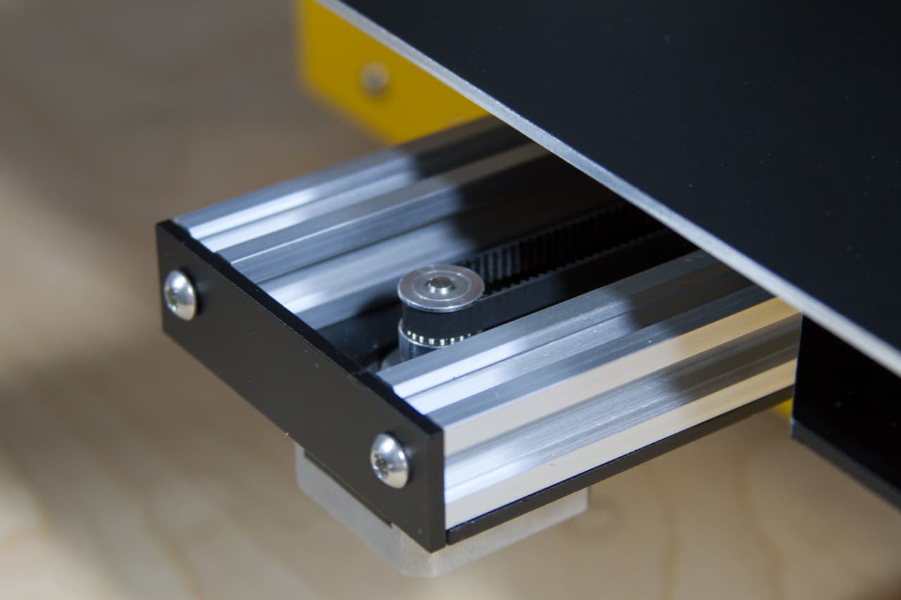 Nothing hidden: screws, belts, wires are visible