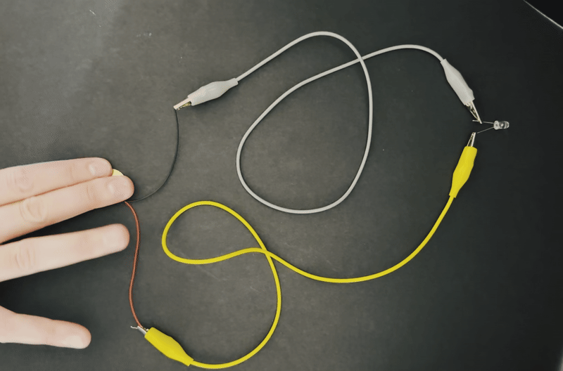 Students exploring piezoelectric sensors and generators with hands-on circuit work