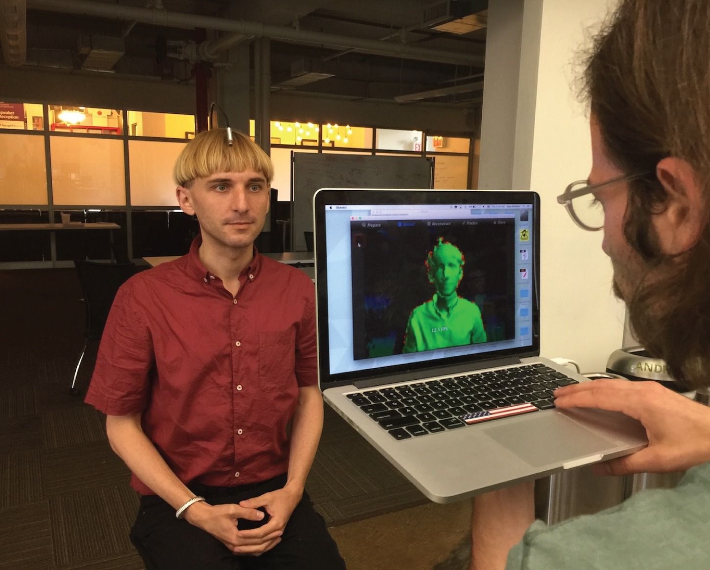 Neil Harbisson being 3D scanned with infrared scanner, point cloud visualization visible