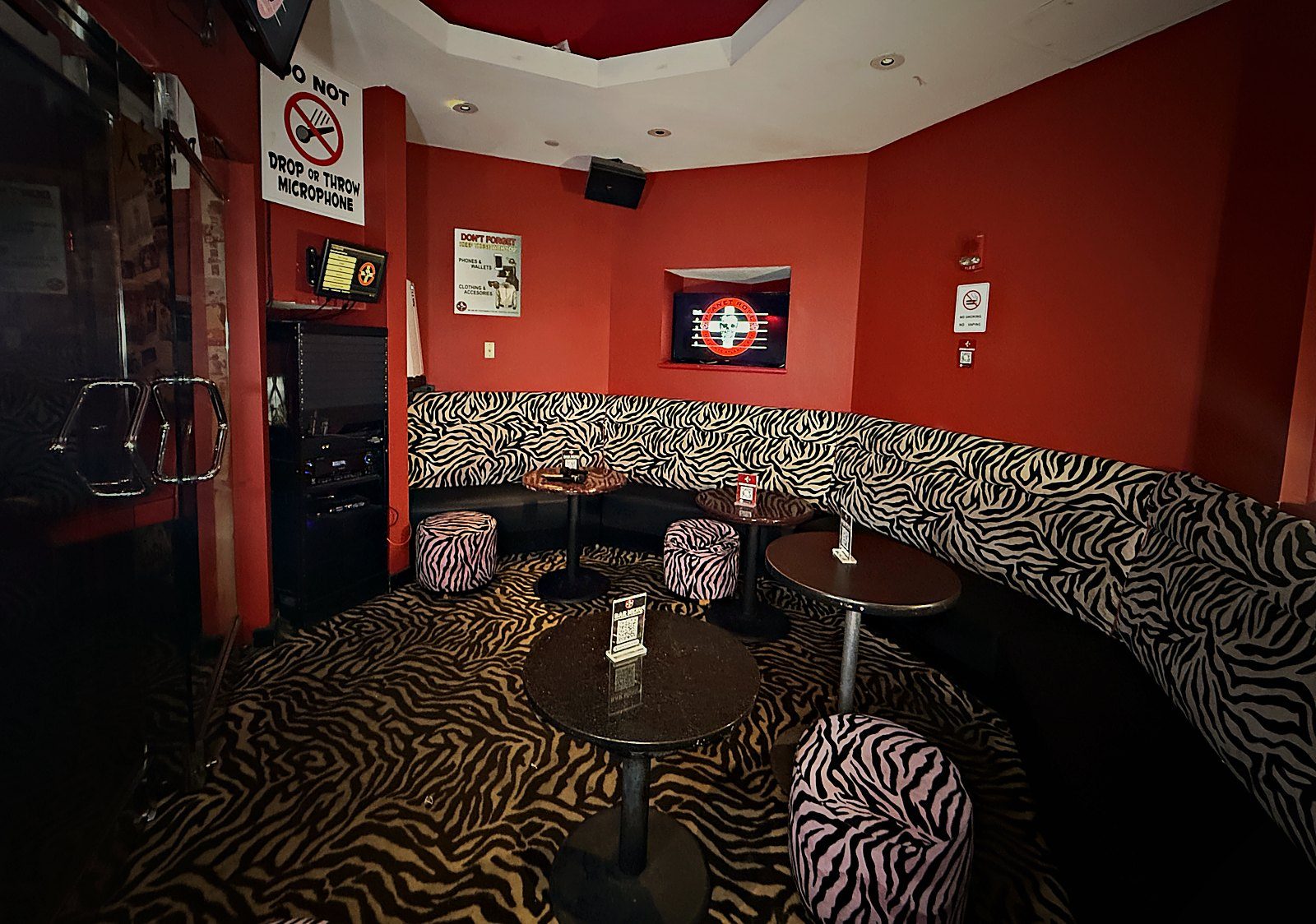 Wide view of the VIP Room with booth seating wrapping around the walls