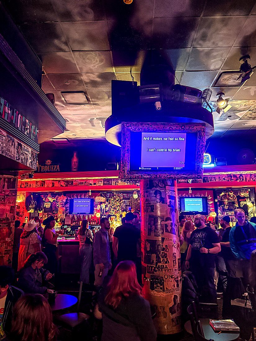The main room packed in front of the karaoke screens
