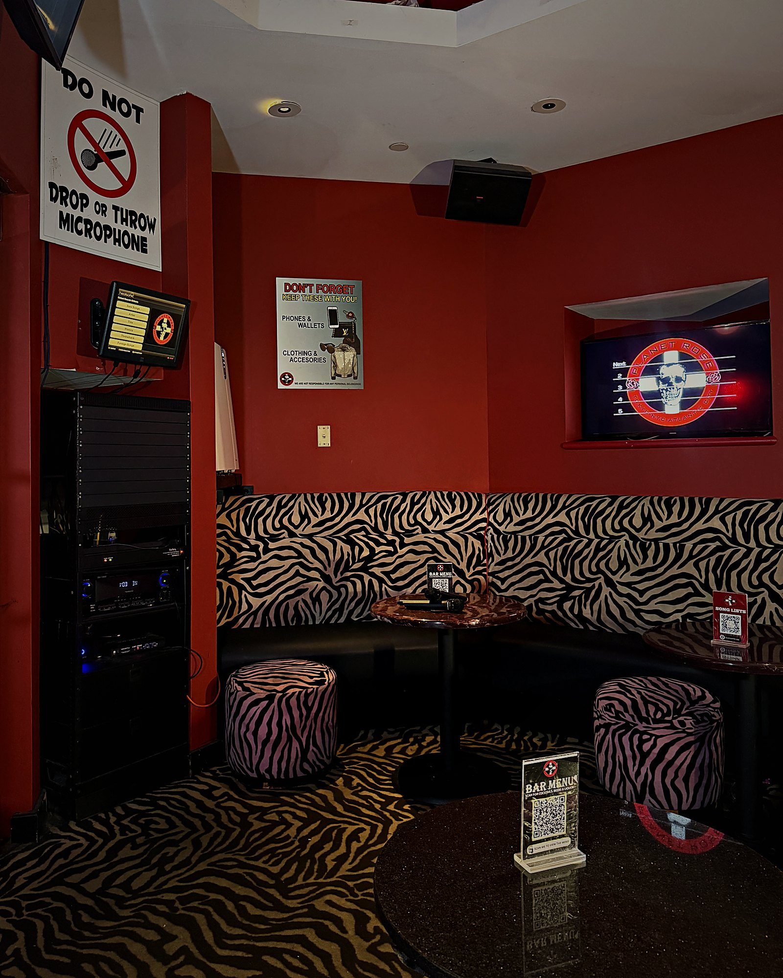 The Planet Rose VIP Room: red walls, zebra-print booth seating, private karaoke screen and sound system