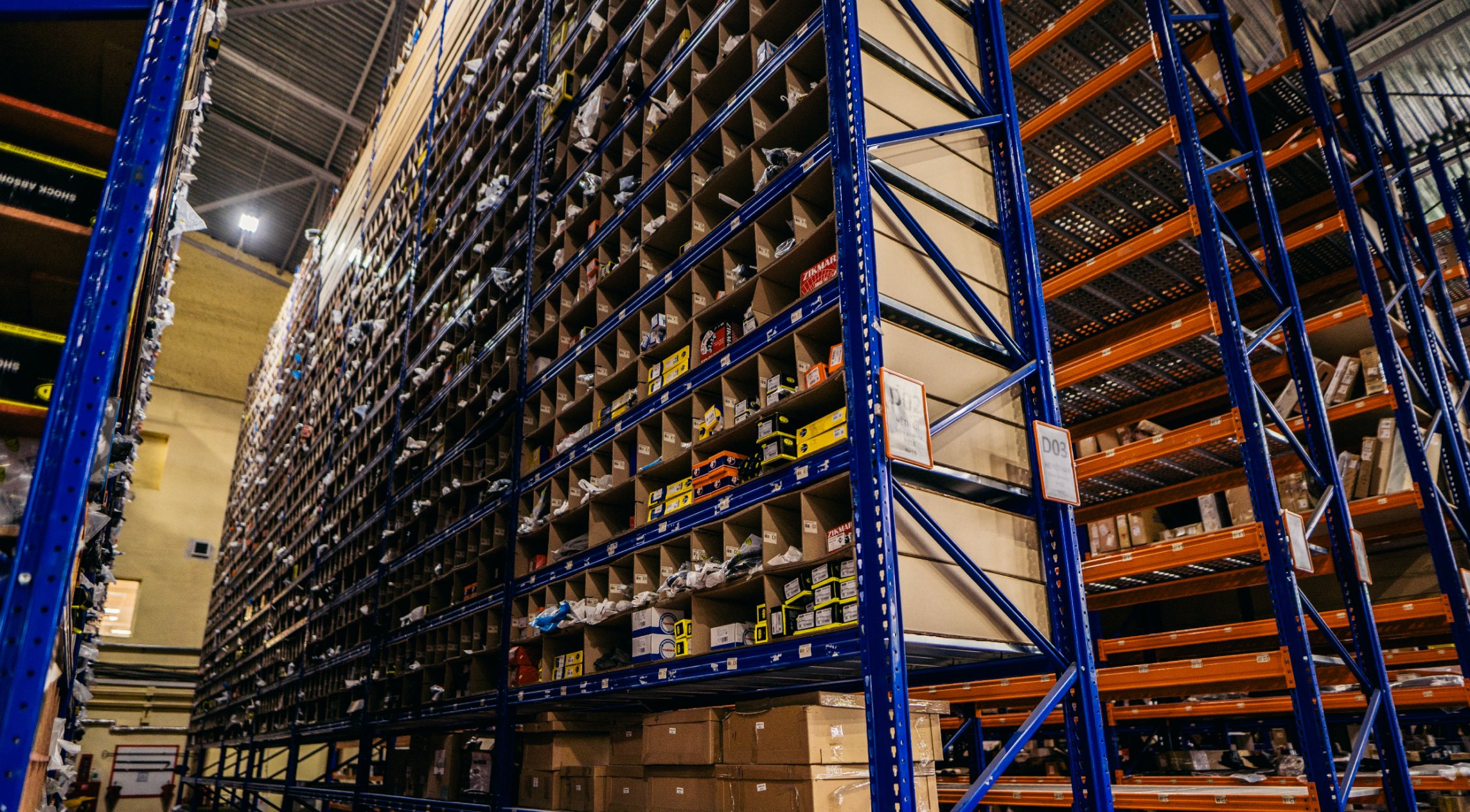 Warehouse storage racks with automotive parts
