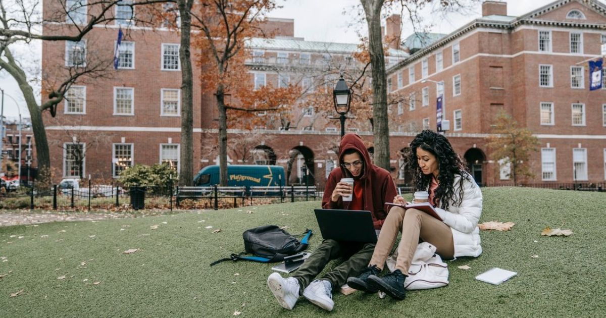 UK boarding school pupils resting and chatting on campus grounds