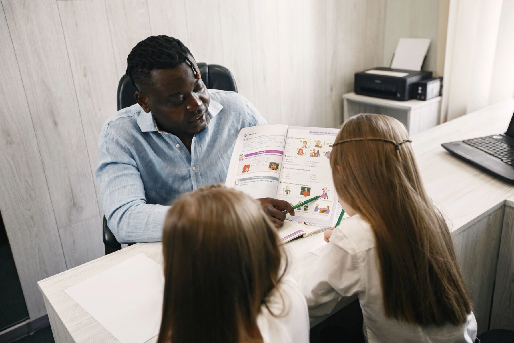 A prospective student engaging warmly during an independent school admissions interview