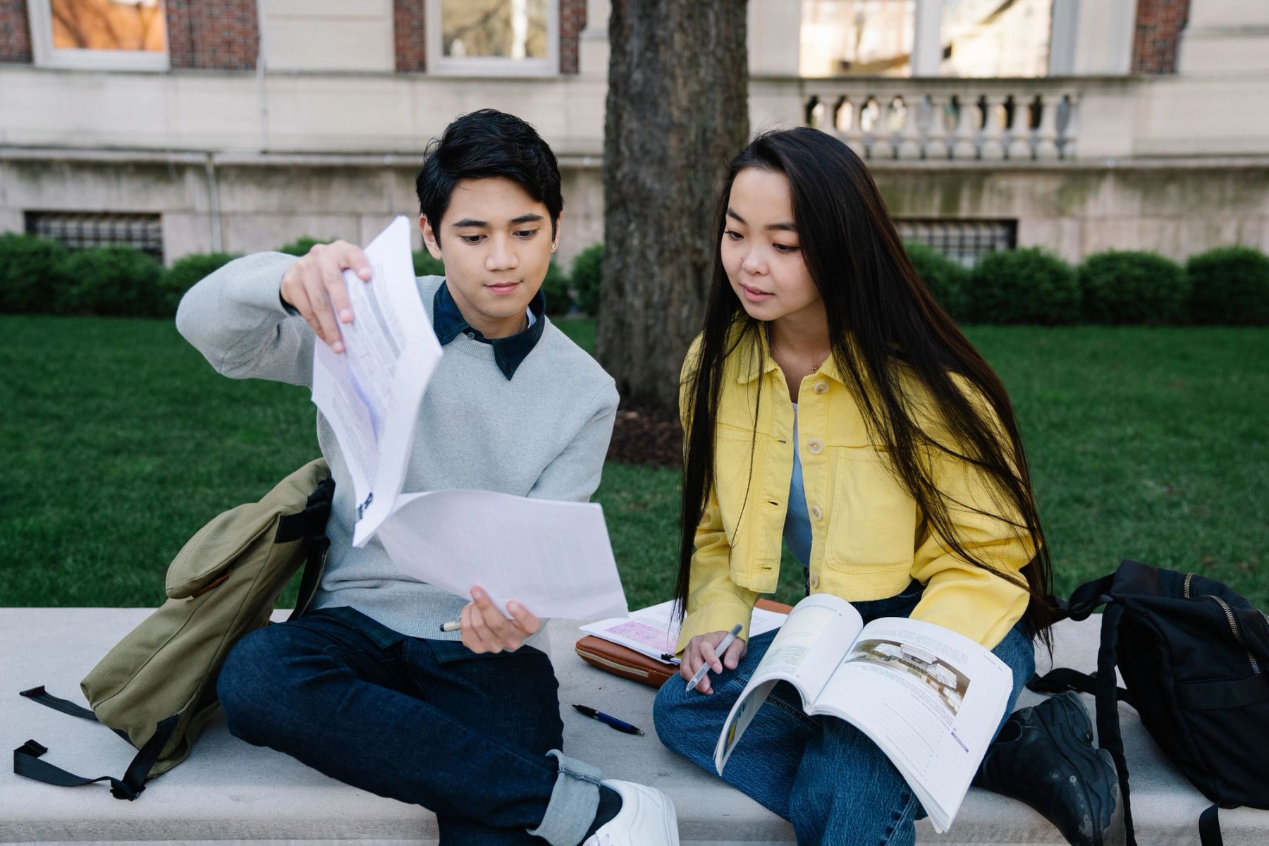Sixth form students studying together outdoors on campus
