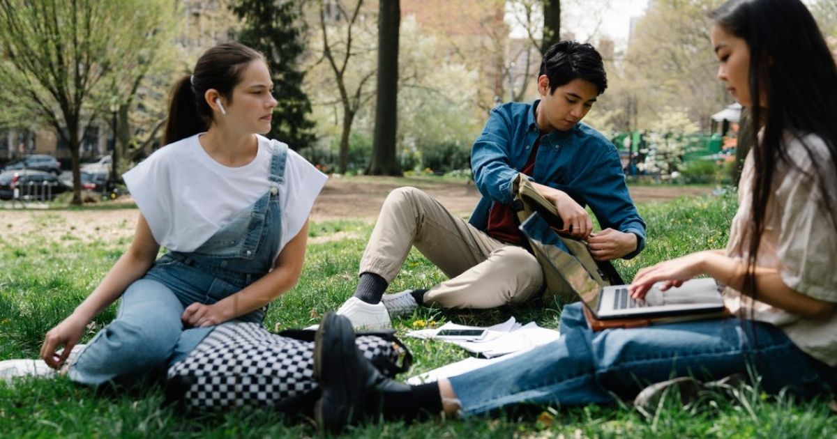 Students walking and talking together on a UK private school campus