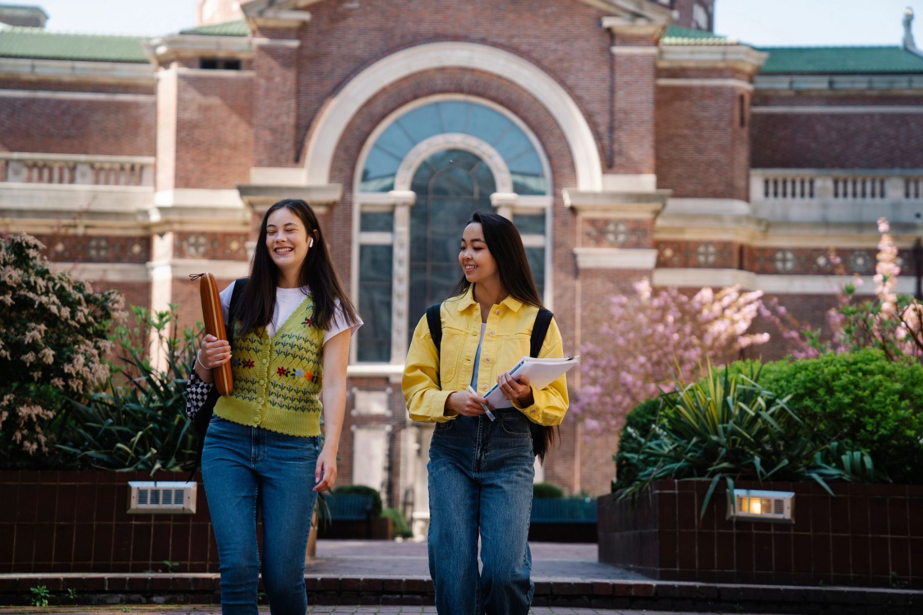 Young students walking together across an independent school campus during a transition visit