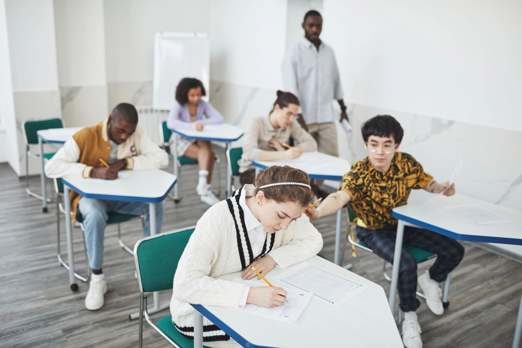 Students taking entrance exams in a classroom at a UK private school