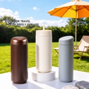 Three tumblers with interchangeable lids in an outdoor setting