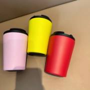 Pink, yellow, and red insulated coffee tumblers