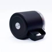 Bottom and handle detail of a black insulated coffee mug