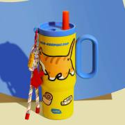 Yellow insulated tumbler shown with decorative accessories