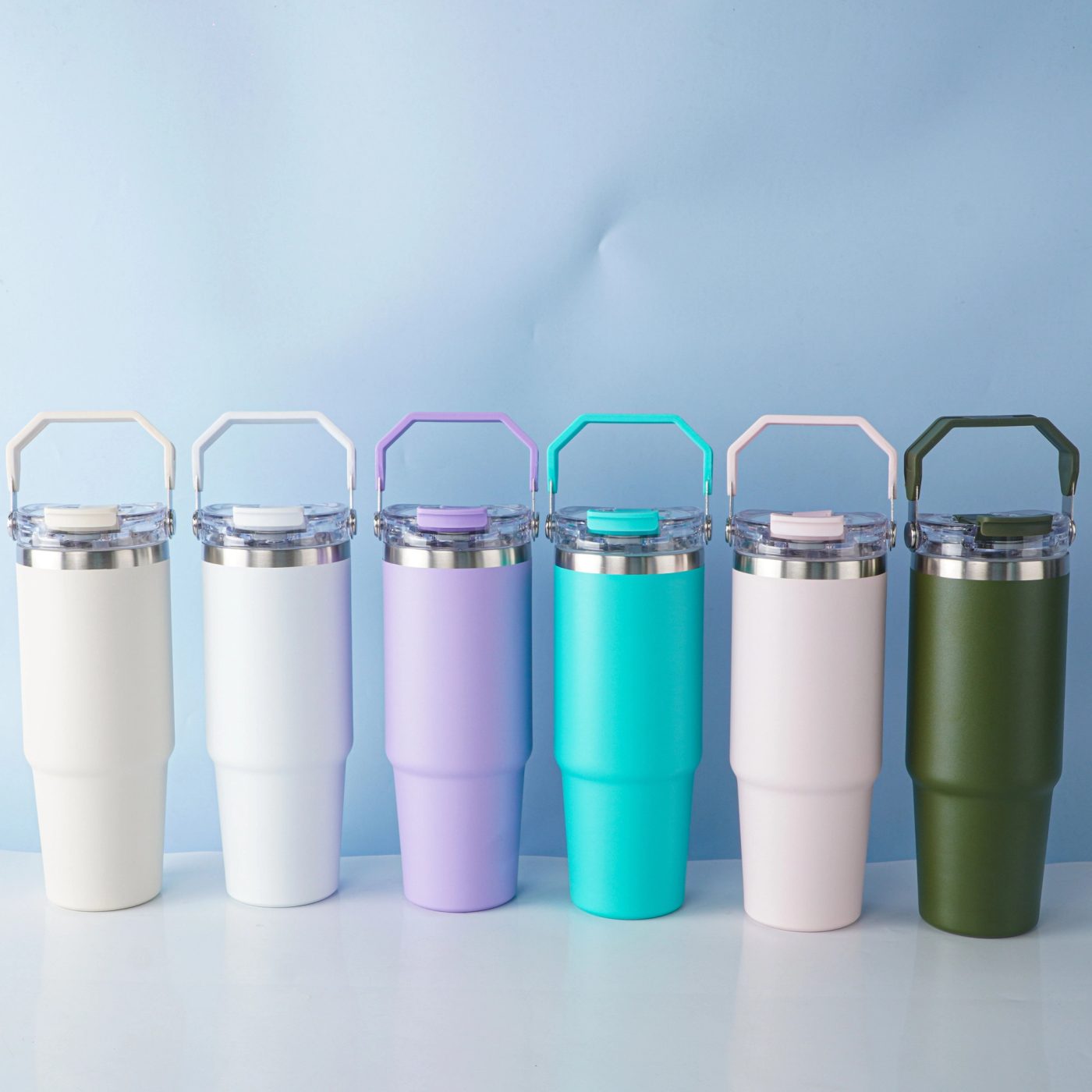 Six colours of 27oz handled travel tumblers