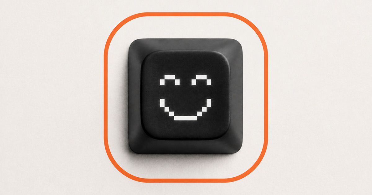 AI engineering copilot: a black keyboard key with a smiling pixel face inside an orange rounded outline