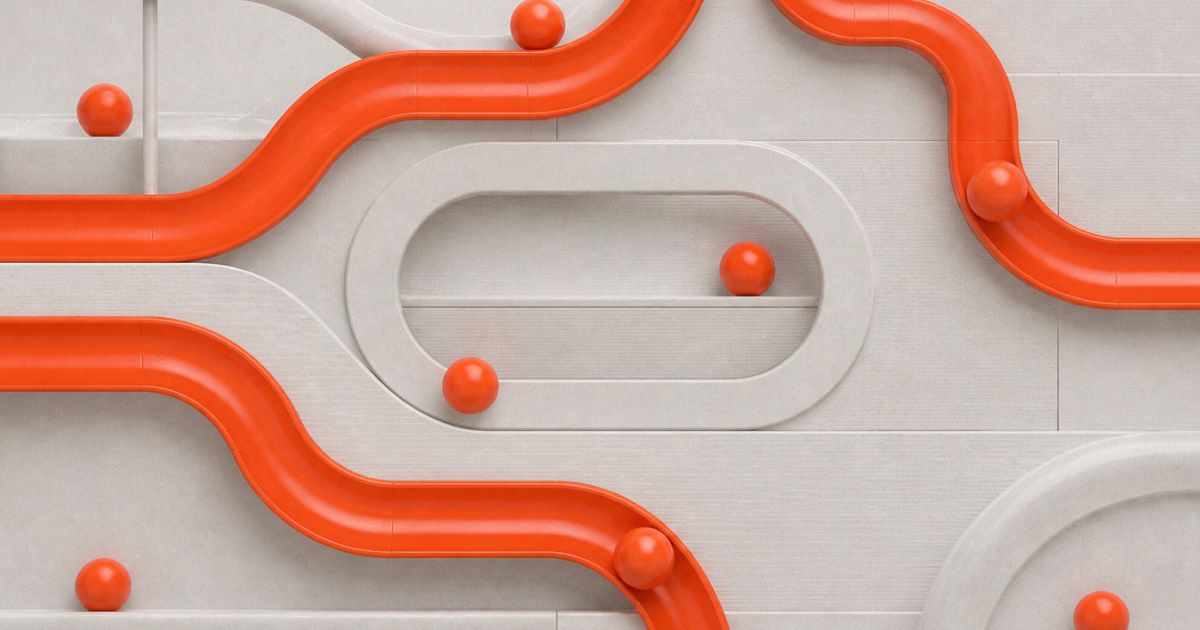 Orange marble-run tracks connecting spheres across a white surface, representing engineering intelligence connecting engineering data versus isolated BI metrics