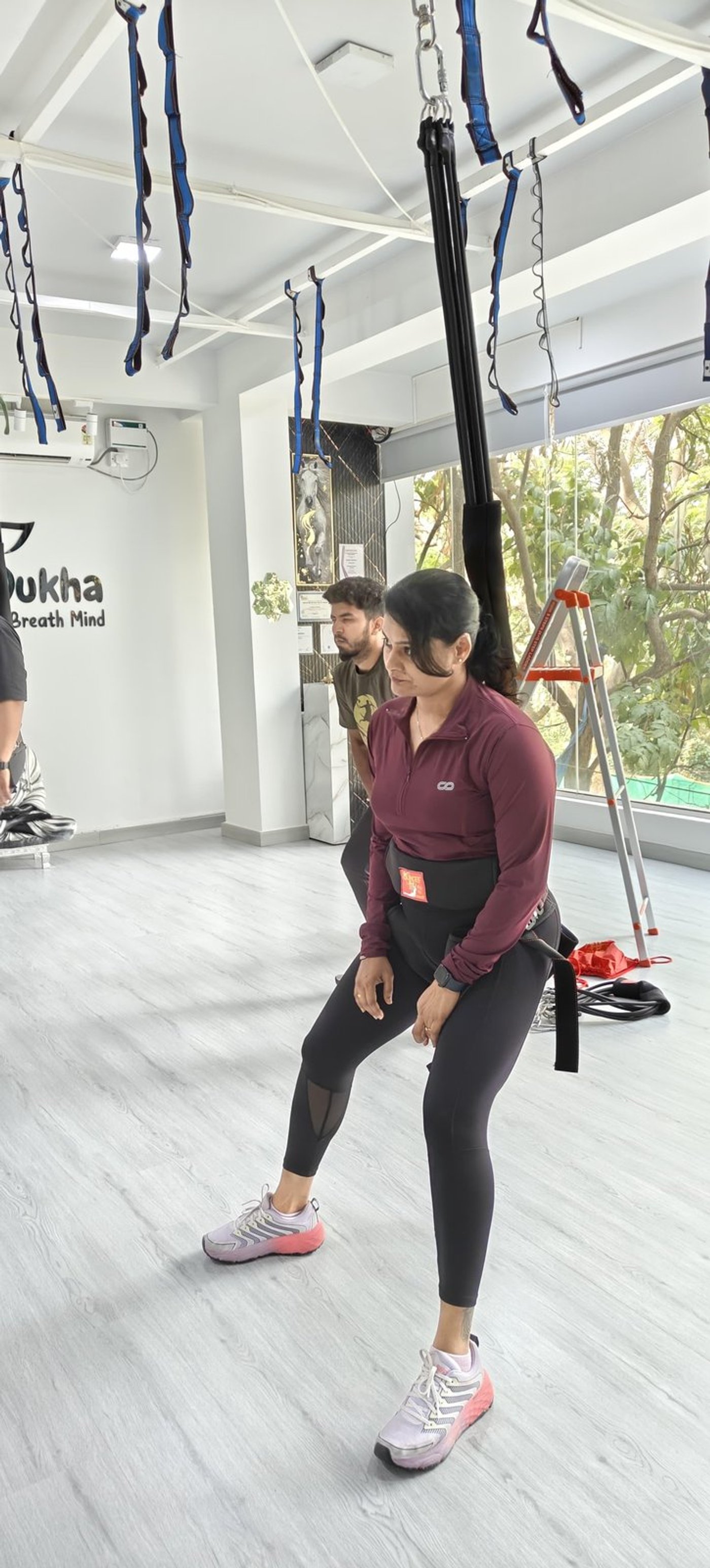 Bungee Fit class with athletes jumping in harnesses at Sukha