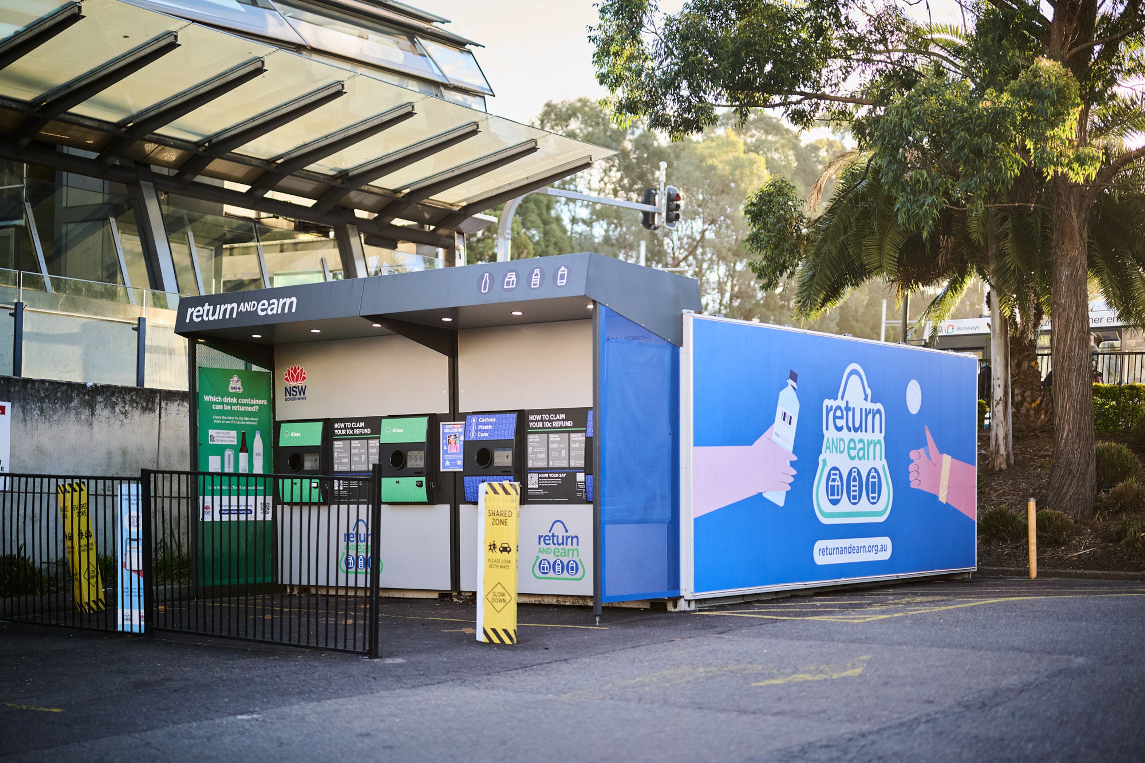 A reverse vending machine in a car park for people to recycle their containers