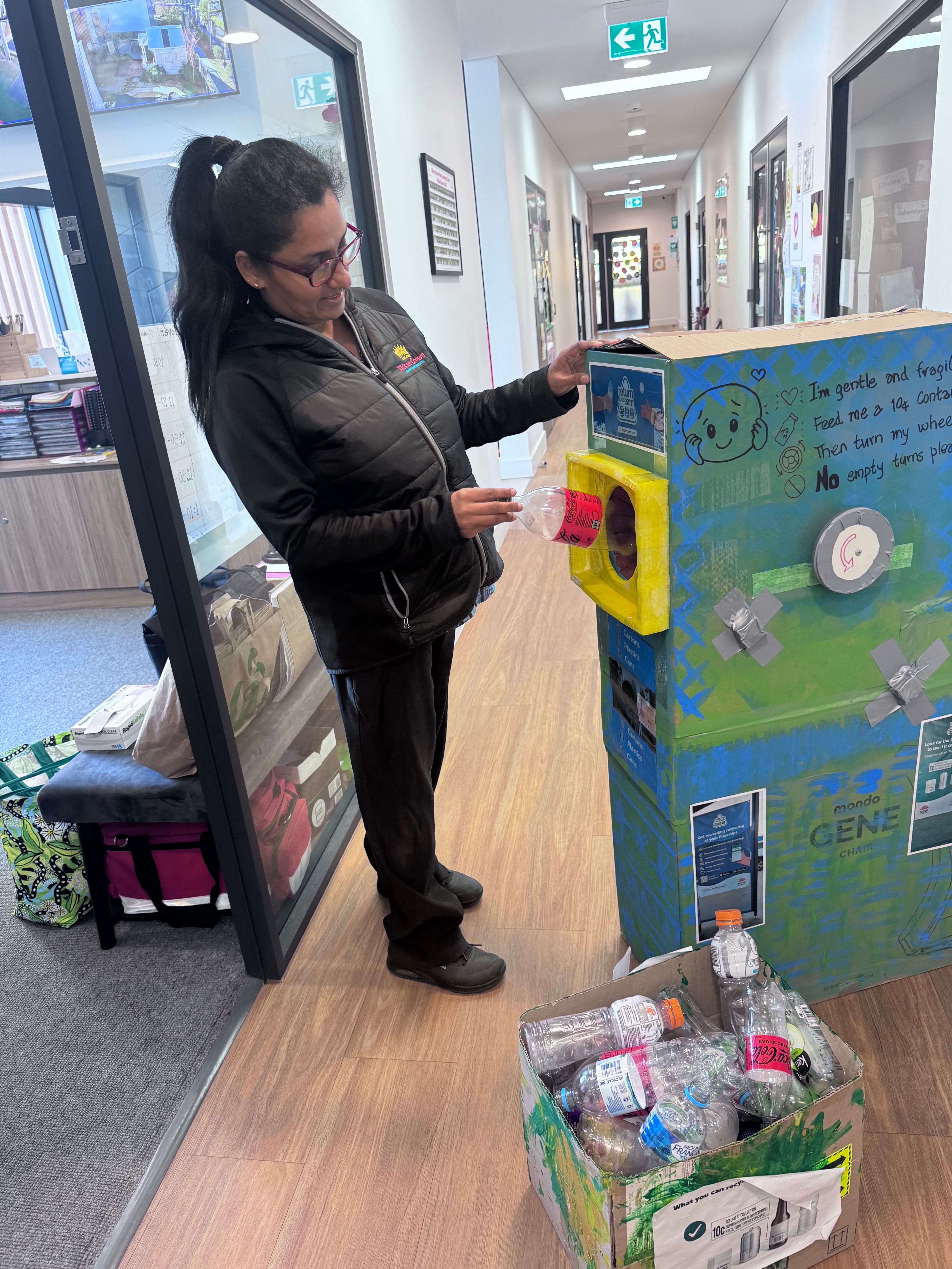 Educator Miss Sashi using their unique bin